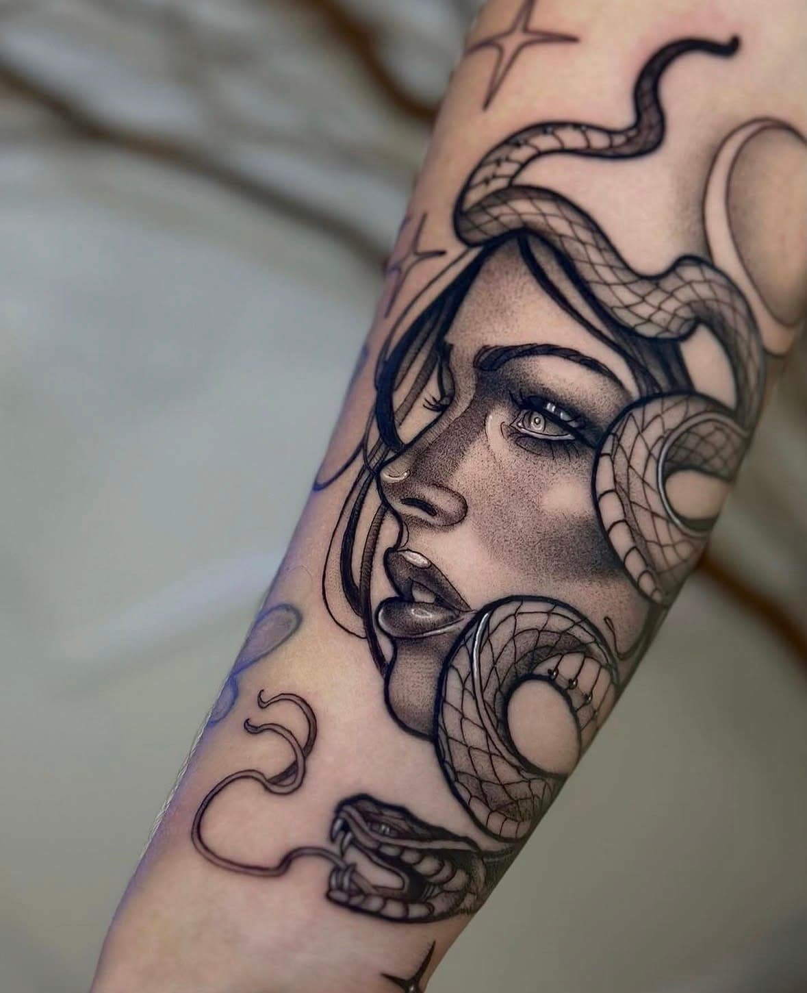 Becca Maurity tattooing a client