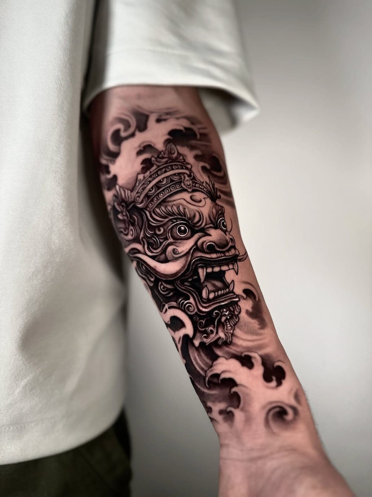 Black and grey guardian mask sleeve on the forearm