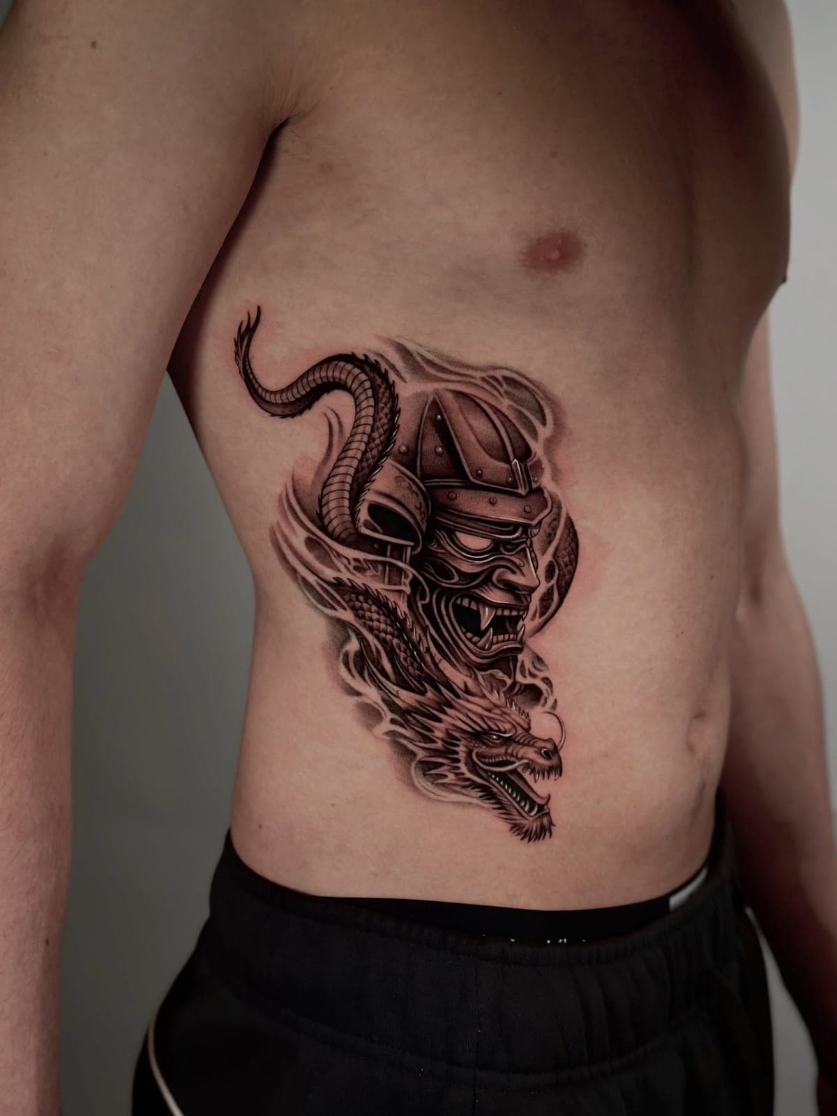 Dragon and samurai helmet on the ribs