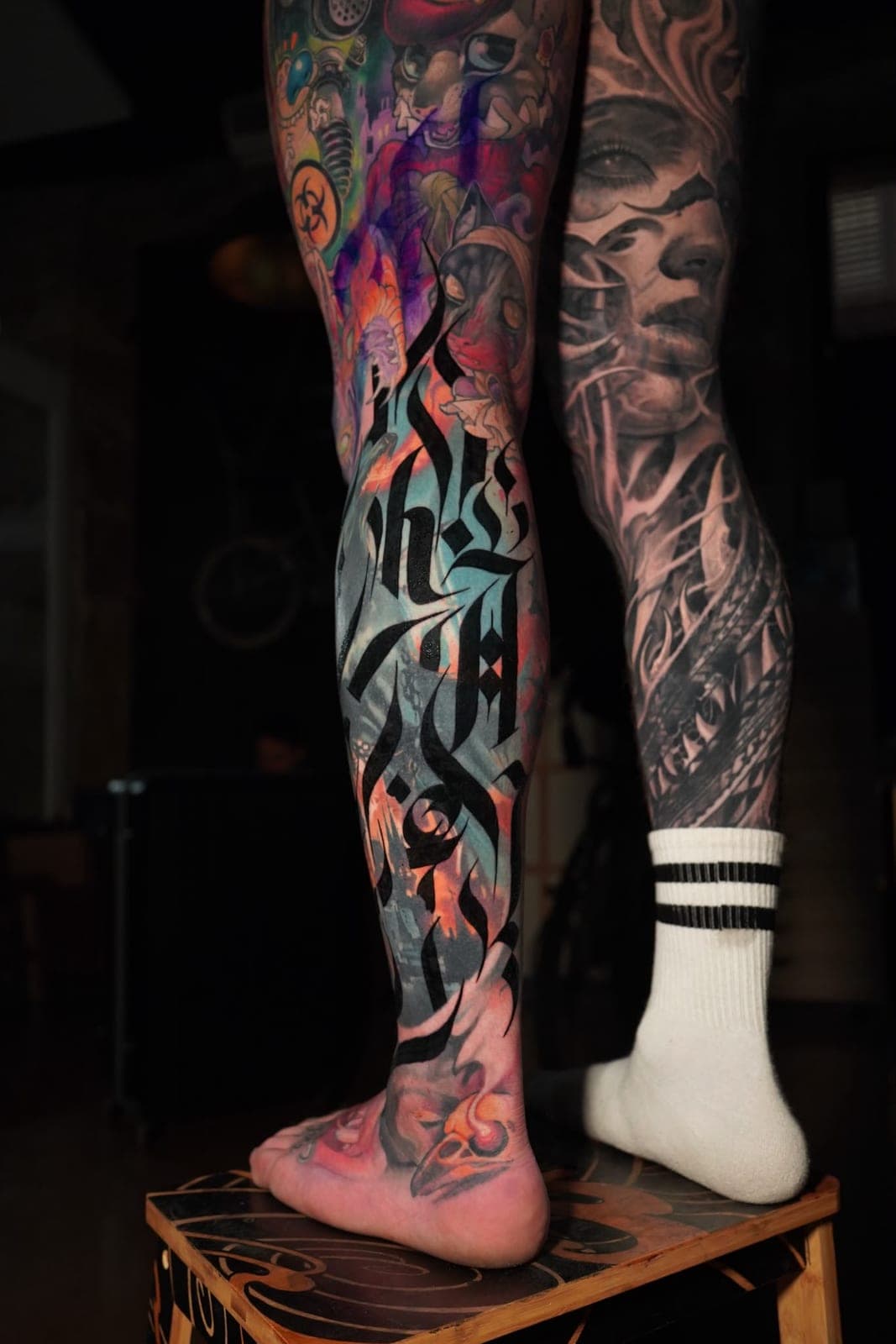 Calligraphy worked into a full colour leg sleeve