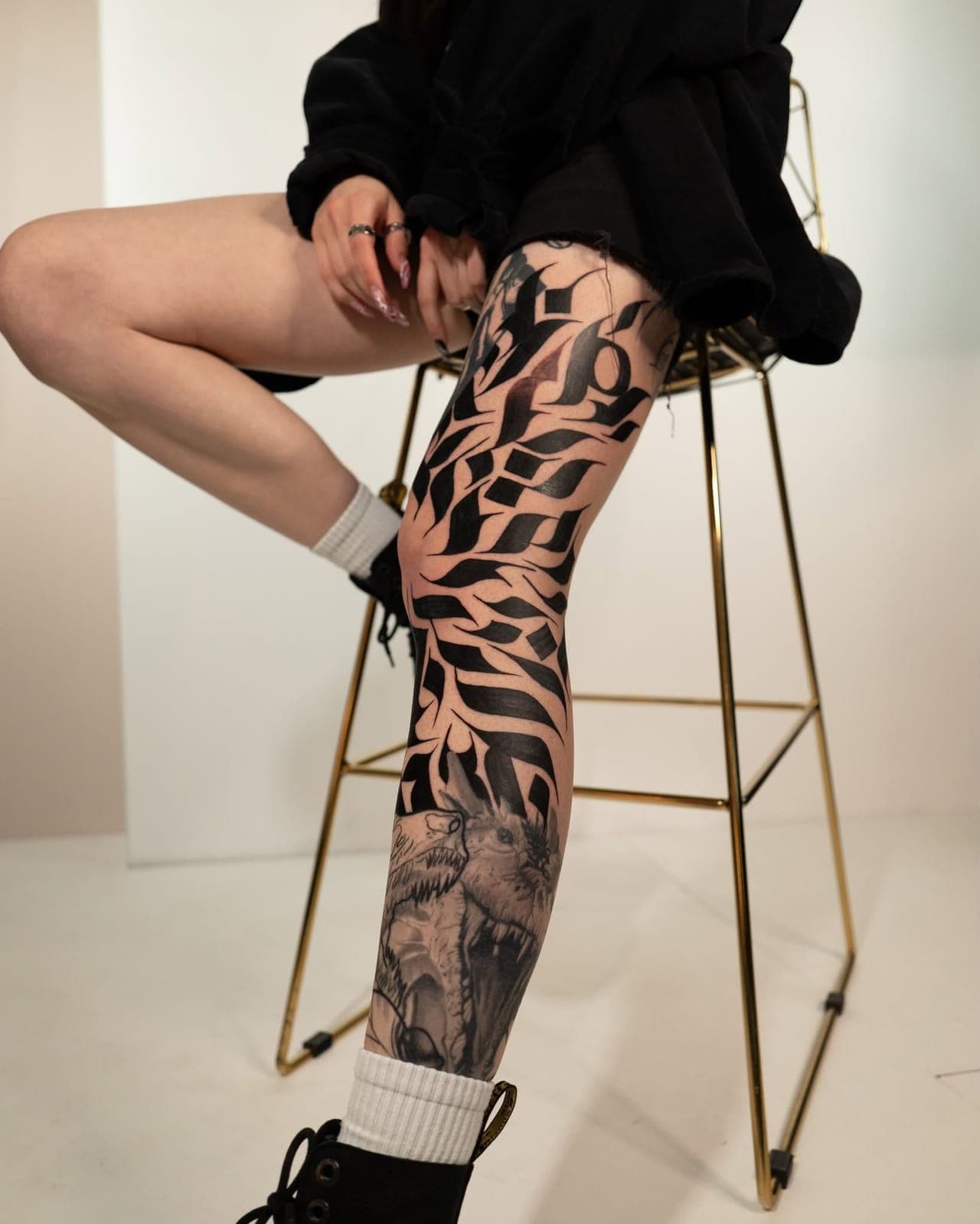 Calligraphy leg sleeve photographed in a white studio