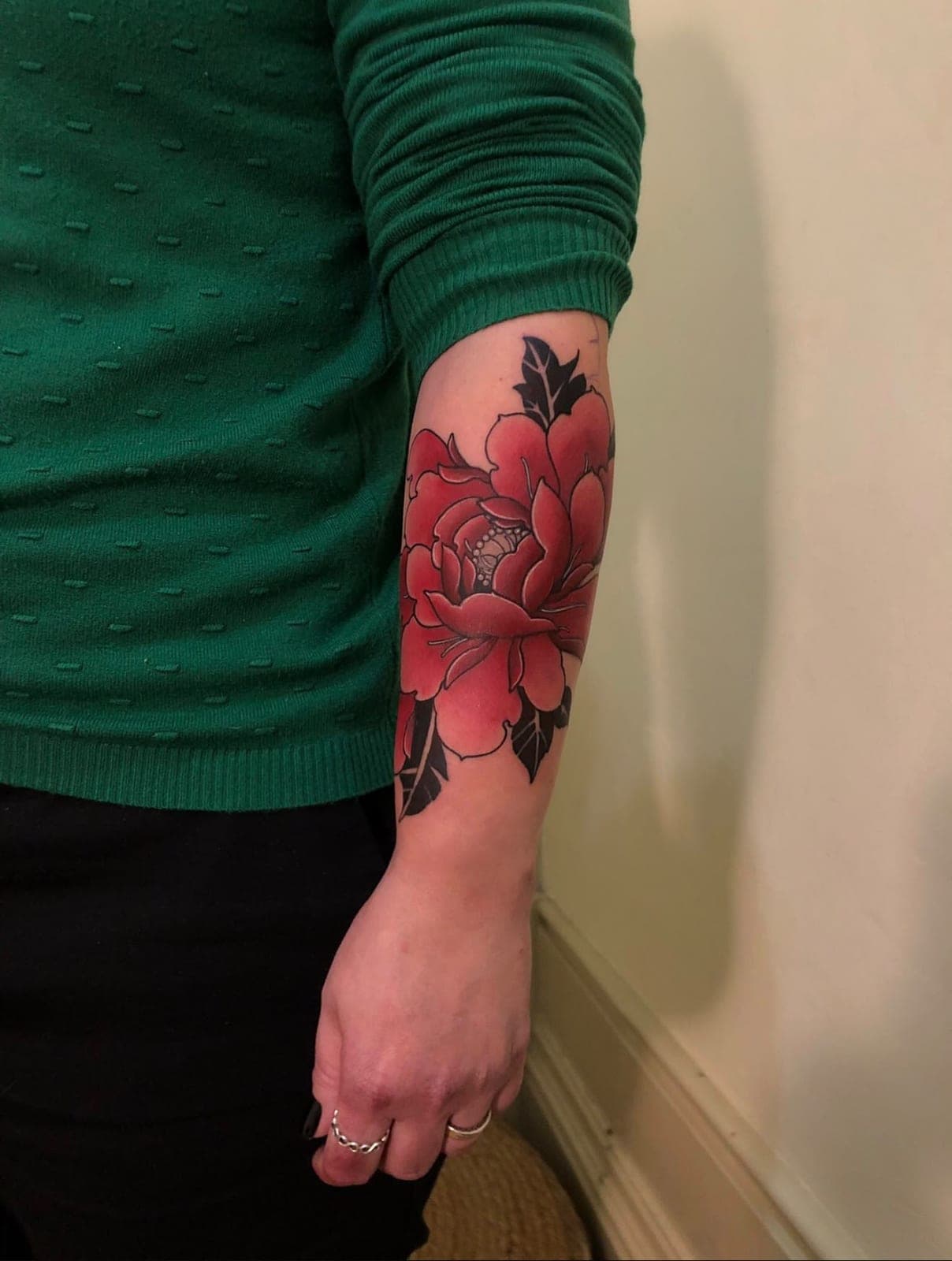 Neo traditional red peony on the forearm