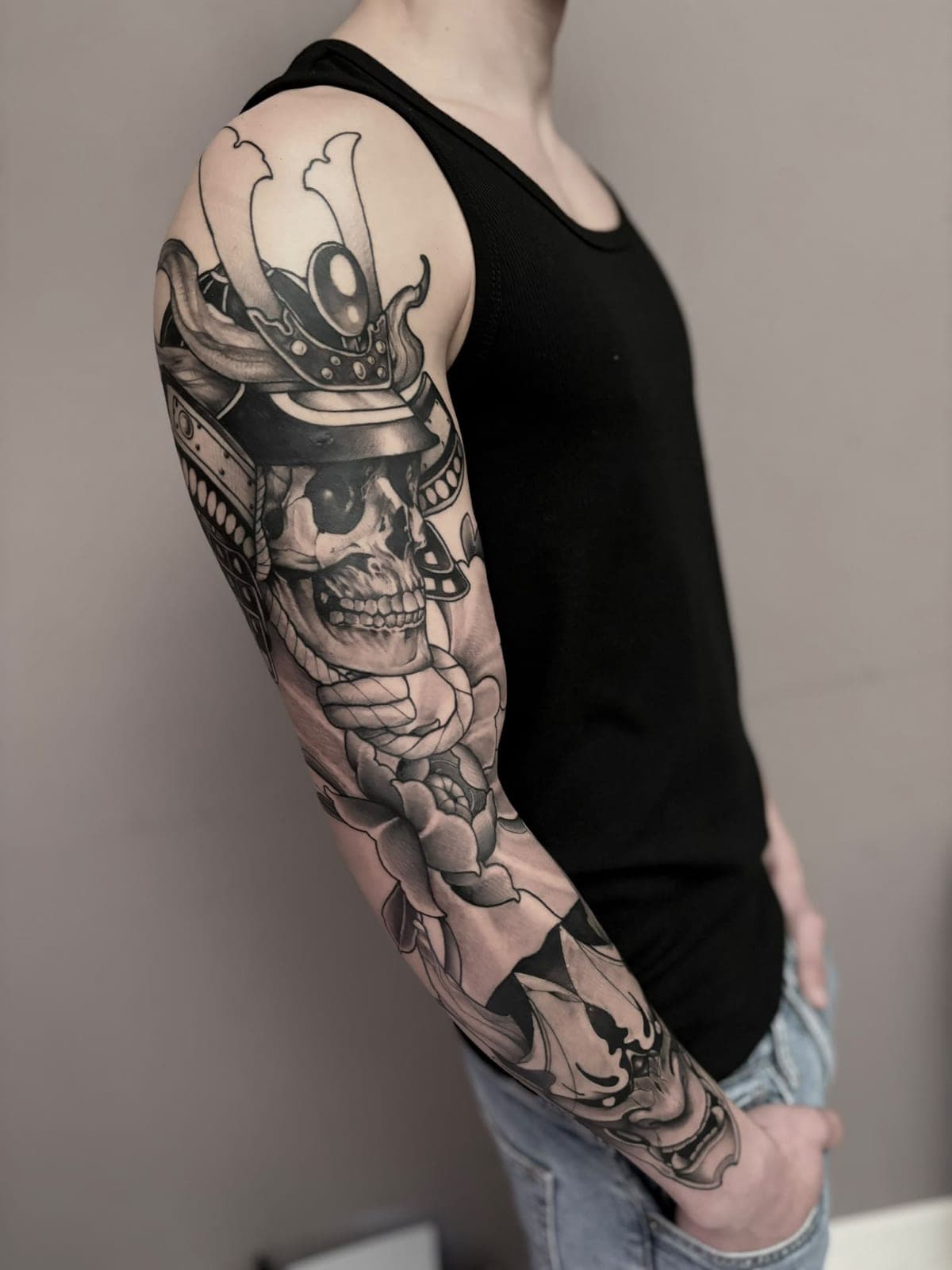 Black and grey sleeve with a samurai skull and peonies